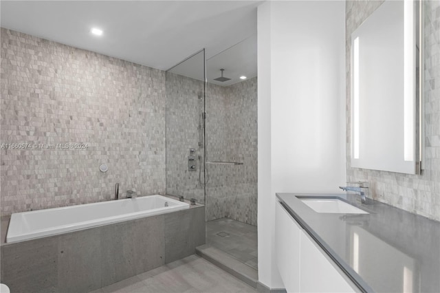 68 SE 6th St Unit 3102, Miami, FL 33131 - full bath featuring a bath, tile walls, walk in shower, vanity, and recessed lighting
