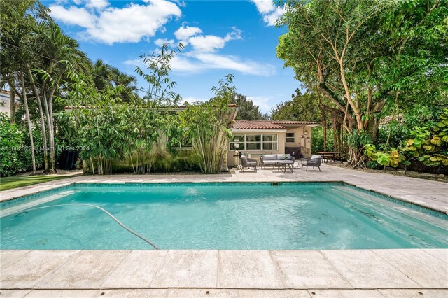 view of swimming pool featuring a patio area