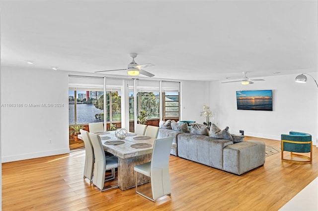 dining area featuring light hardwood / wood-style flooring and ceiling fan