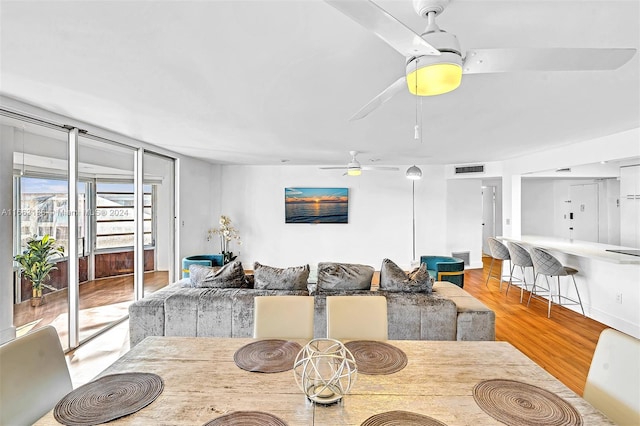 dining room featuring light wood-type flooring and ceiling fan