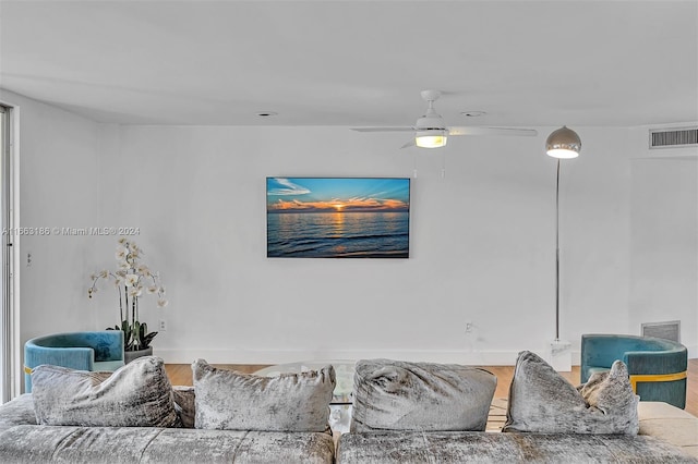 living room with hardwood / wood-style floors and ceiling fan