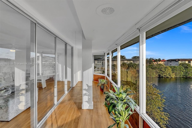 sunroom with a water view