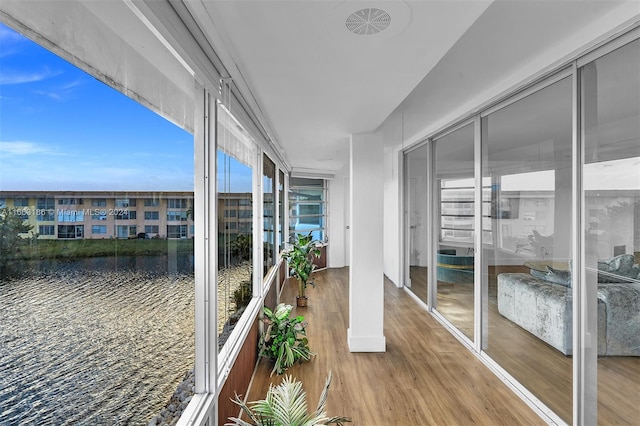 balcony featuring a water view