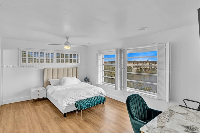 bedroom with hardwood / wood-style floors and ceiling fan