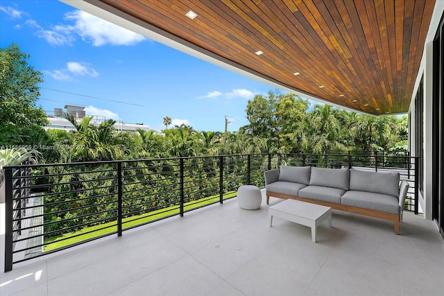 view of patio / terrace with a balcony and an outdoor living space