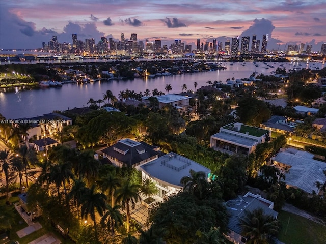 aerial view at dusk with a water view