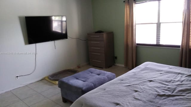 bedroom featuring light tile patterned floors