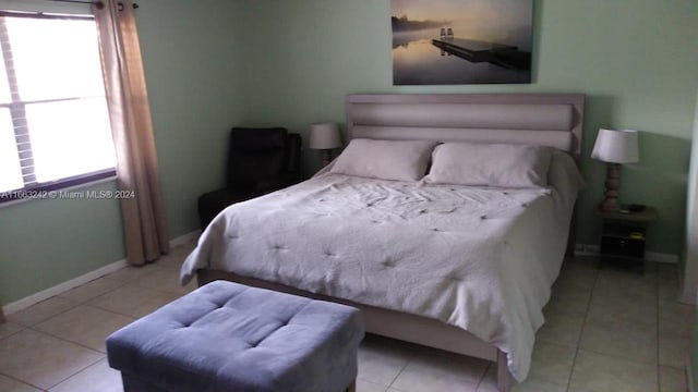 bedroom featuring light tile patterned floors