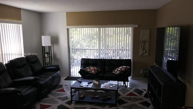 tiled living room with a textured ceiling