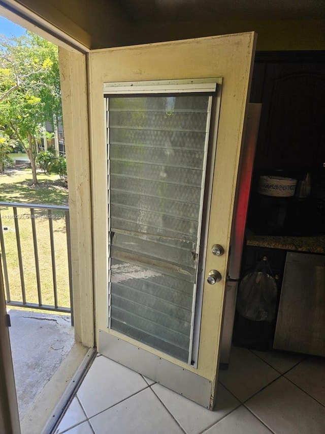 exterior space featuring a healthy amount of sunlight and tile patterned flooring