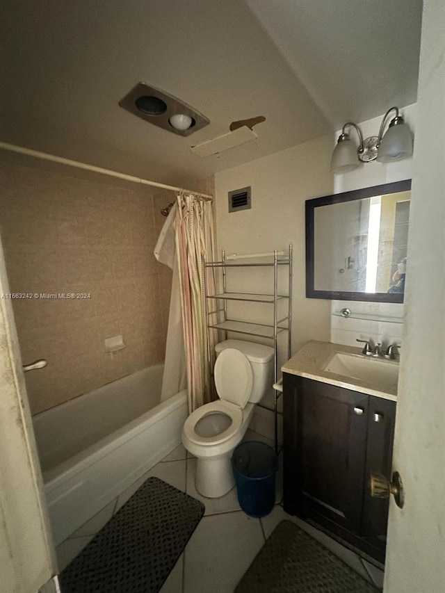 full bathroom featuring shower / bath combo, tile patterned flooring, vanity, and toilet