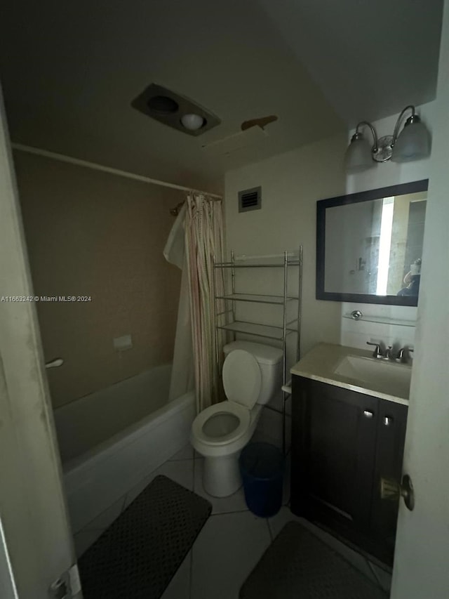 full bathroom featuring shower / bath combination with curtain, tile patterned flooring, vanity, and toilet