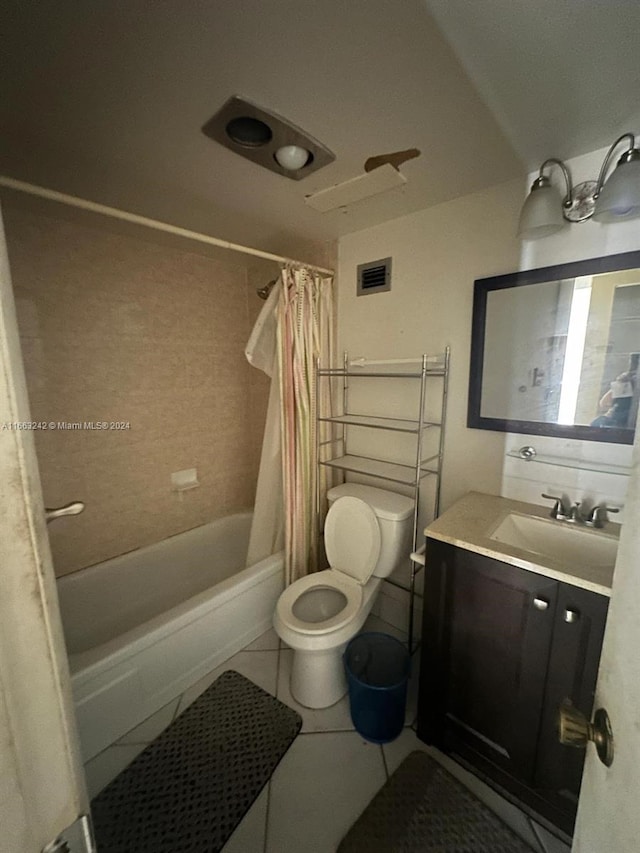 full bathroom featuring shower / bath combination with curtain, vanity, toilet, and tile patterned floors