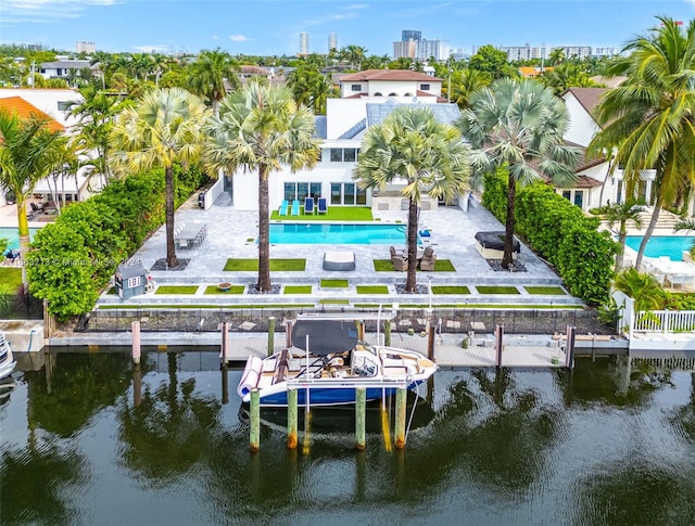 dock area featuring a patio and a water view