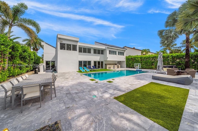 view of swimming pool with a patio