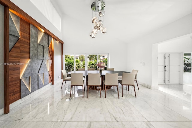 dining room featuring high vaulted ceiling and french doors