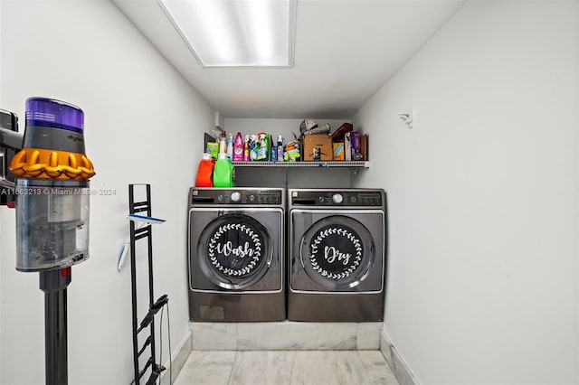 laundry room with washing machine and clothes dryer