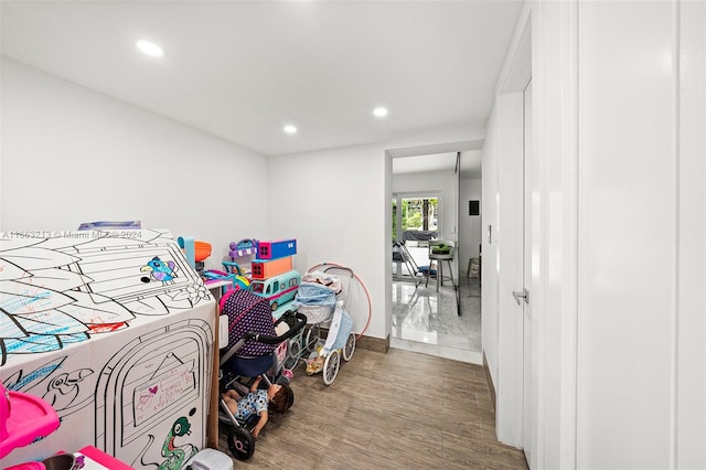 bedroom with hardwood / wood-style floors