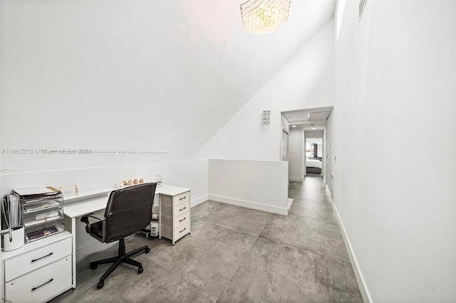 home office featuring lofted ceiling