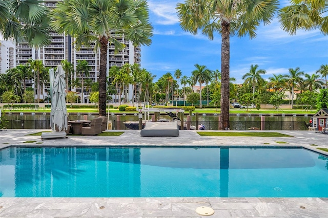 view of pool with a water view