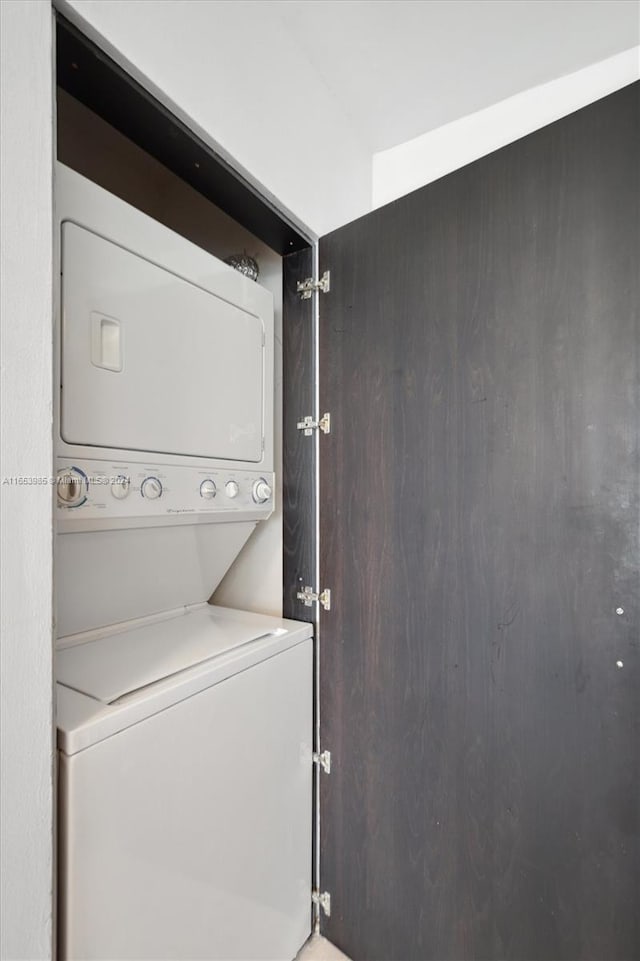 laundry area with stacked washer and clothes dryer