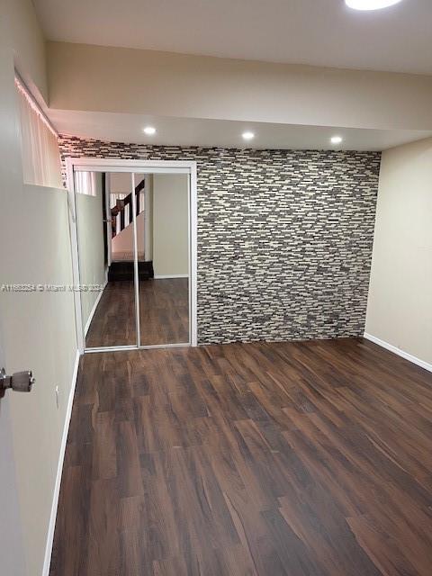 interior space with dark wood-type flooring