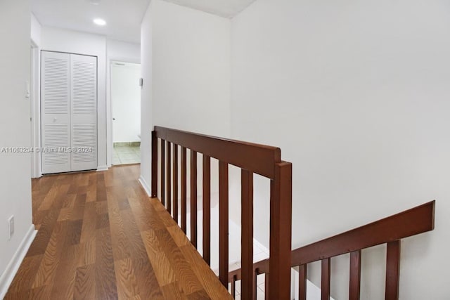 corridor featuring dark hardwood / wood-style floors