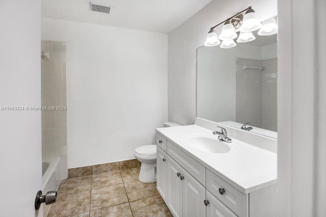 full bathroom with tiled shower / bath combo, vanity, tile patterned flooring, and toilet