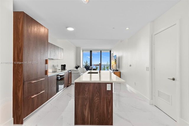 kitchen featuring black oven and a center island