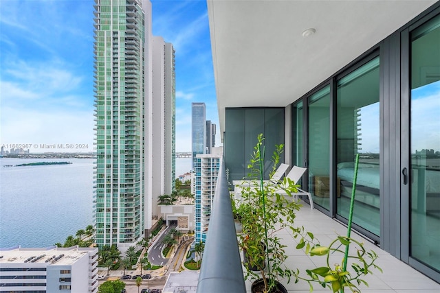 balcony featuring a water view