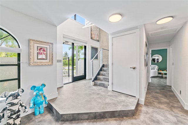 entrance foyer with concrete floors and a wealth of natural light