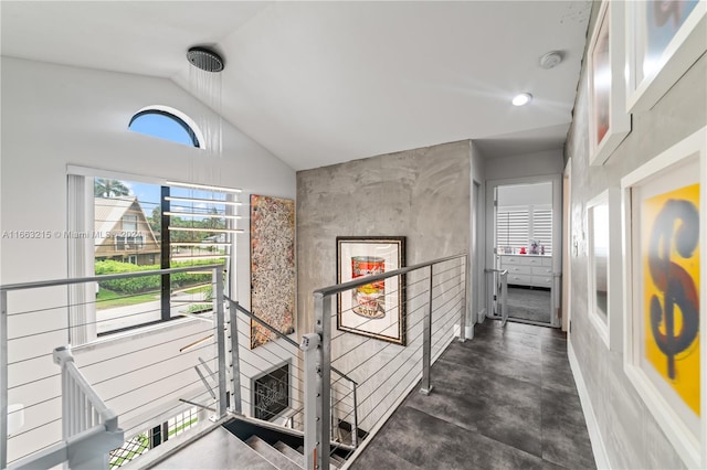 corridor featuring high vaulted ceiling