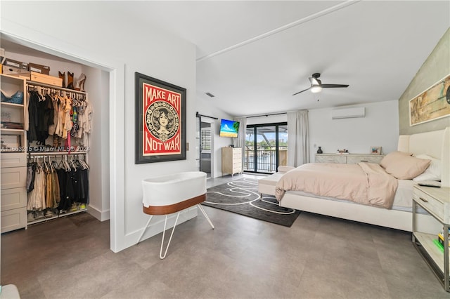 bedroom featuring a closet, a wall unit AC, access to outside, concrete floors, and ceiling fan