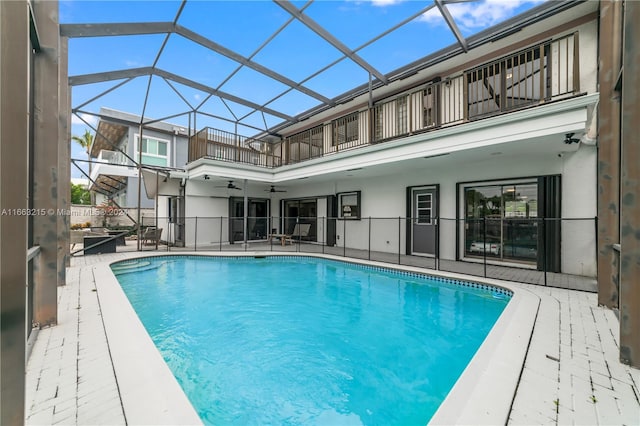 view of swimming pool with a patio and a lanai