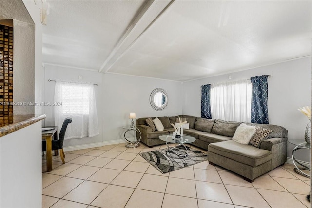 living room with beam ceiling and light tile patterned floors