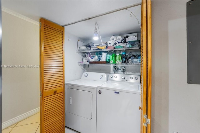 washroom with light tile patterned floors and separate washer and dryer