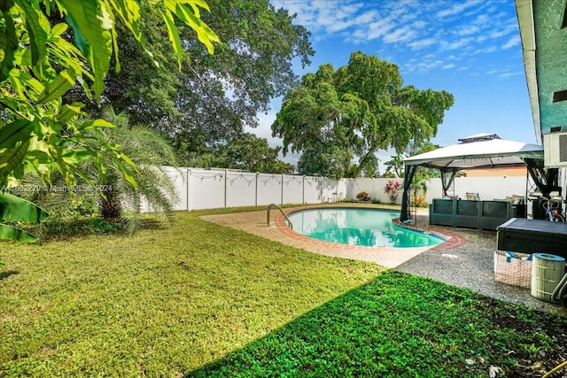 view of pool featuring a gazebo, a yard, and a patio area