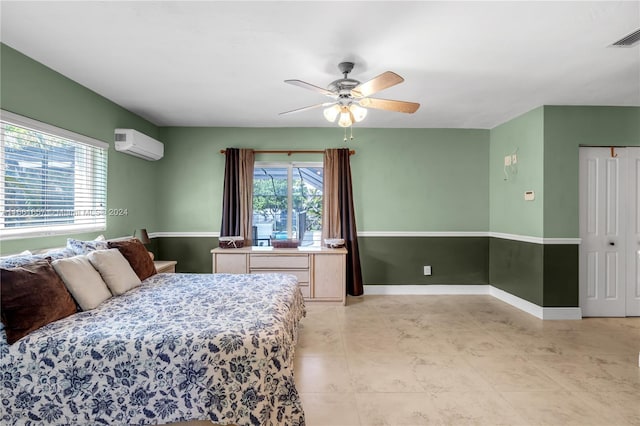 bedroom with ceiling fan, a closet, and a wall mounted AC