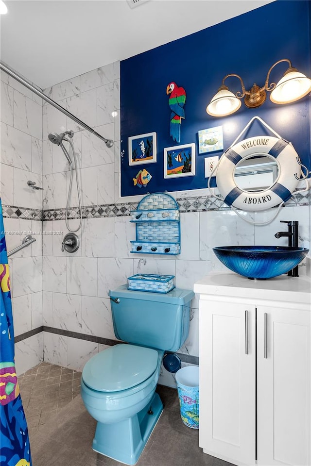 bathroom with vanity, tile walls, toilet, and a shower with shower curtain