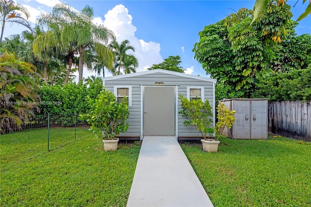 view of outdoor structure with a yard