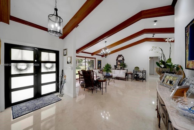 foyer entrance with french doors, vaulted ceiling with beams, and a chandelier