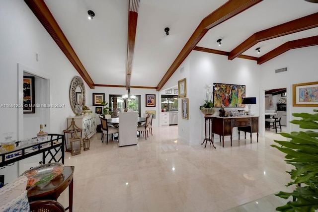 interior space with high vaulted ceiling, a chandelier, and beamed ceiling