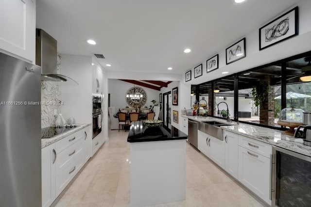 7706 SW 74th Ln, Miami, FL 33143 - kitchen featuring visible vents, a kitchen island, beverage cooler, stainless steel appliances, and a notable chandelier