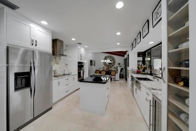 7706 SW 74th Ln, Miami, FL 33143 - kitchen featuring white cabinetry, visible vents, appliances with stainless steel finishes, and a kitchen island