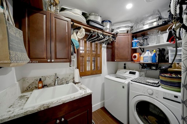 7706 SW 74th Ln, Miami, FL 33143 - laundry area with baseboards, washing machine and clothes dryer, cabinet space, dark wood finished floors, and a sink
