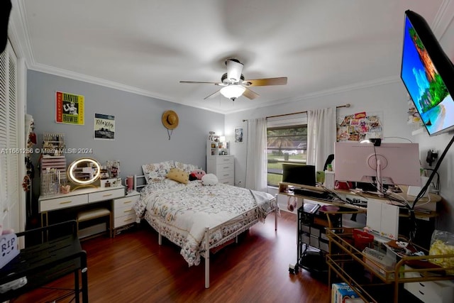 bedroom featuring crown molding, dark wood-type flooring, and ceiling fan