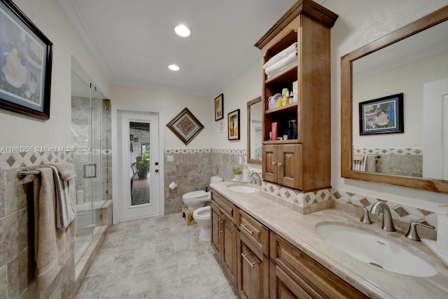 bathroom featuring tile walls, a bidet, an enclosed shower, vanity, and toilet