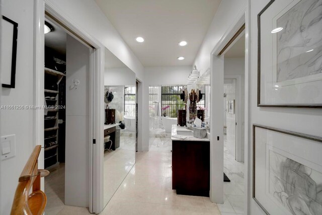 7706 SW 74th Ln, Miami, FL 33143 - full bathroom featuring recessed lighting, vanity, and a walk in closet