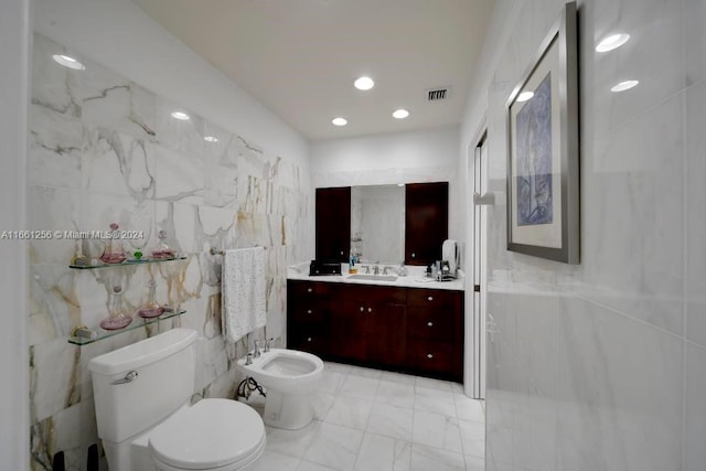 7706 SW 74th Ln, Miami, FL 33143 - full bath with vanity, visible vents, marble finish floor, tile walls, and a bidet