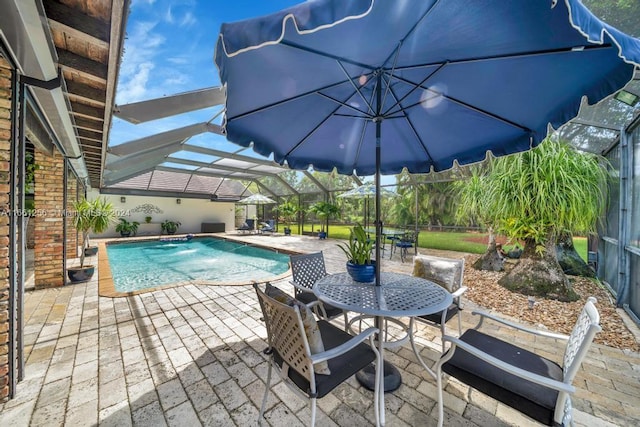 7706 SW 74th Ln, Miami, FL 33143 - pool with a lanai, a patio area, and outdoor dining area
